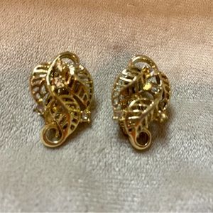 Vintage scrolled Gold toned earrings with crystal accents Leaf design.